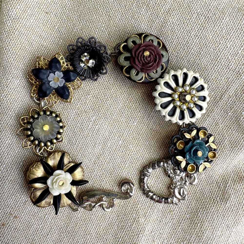 Metal Monk 7 link floral assemblage bracelet